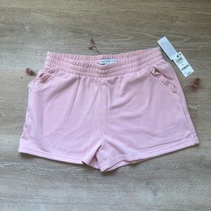 “And Now This” pink shorts 🩳.